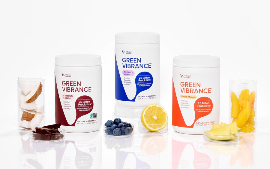 Three different flavors of Green Vibrance: Blueberry Lemon, Peach Mango, and Chocolate Coconut