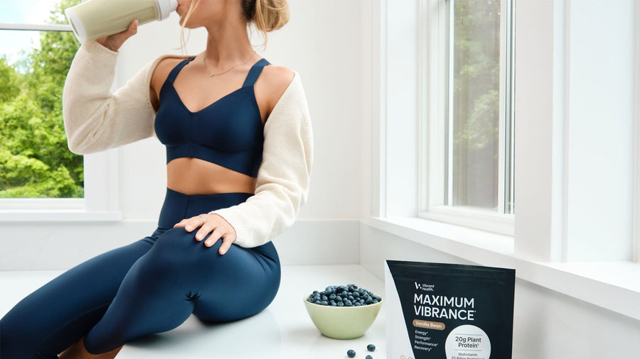 A young women drinking a Plant-Based Protein shake.