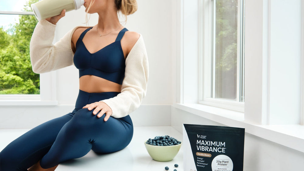 A young women drinking a Plant-Based Protein shake.