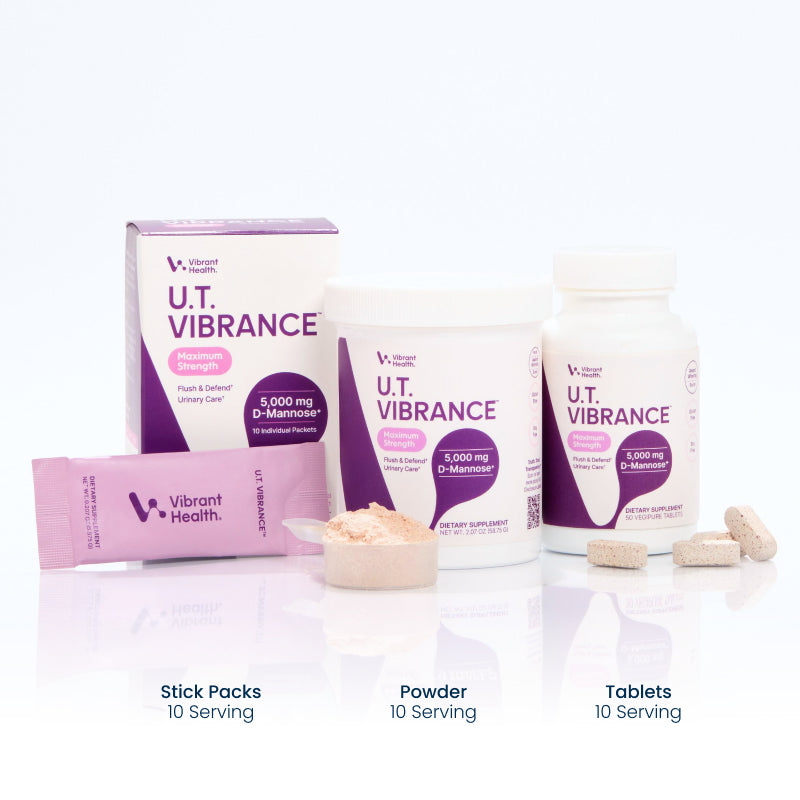 UT Vibrance stick packs, powder, and tablets on a reflective white background.